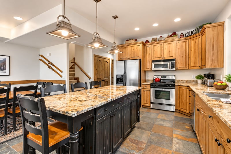 Cook with ease in your fully equipped kitchen with granite counters, stainless steel appliances, and seating for four at the island.