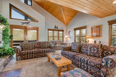 The open layout keeps the conversation flowing between the living, dining, and kitchen zones.
