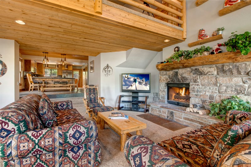Gather around the fireplace after skiing or hiking in this inviting main living space.
