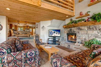 Gather around the fireplace after skiing or hiking in this inviting main living space.