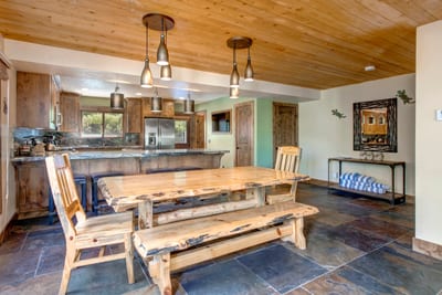 Share casual meals and conversation at the farmhouse dining table just off the kitchen.