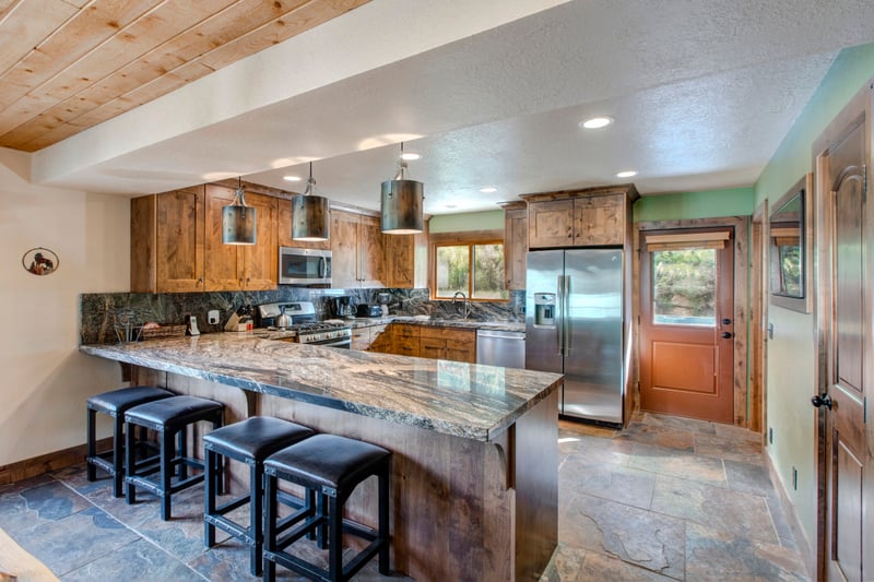 Additional dining space beside the kitchen gives flexibility for larger gatherings or board game nights.
