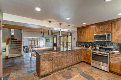 Fully equipped kitchen with stainless appliances and a breakfast bar makes cooking easy for your group.
