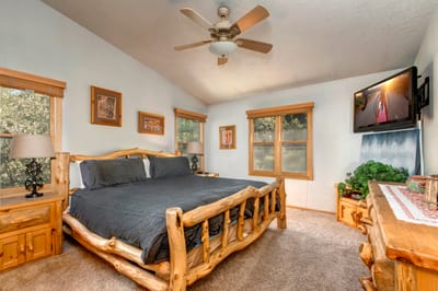 The primary bedroom includes a King bed, ceiling fan, and ensuite bath for total comfort and privacy.