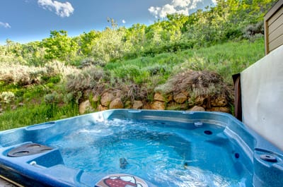 Soak under the trees in your private hot tub, perfect after a day of mountain adventures.