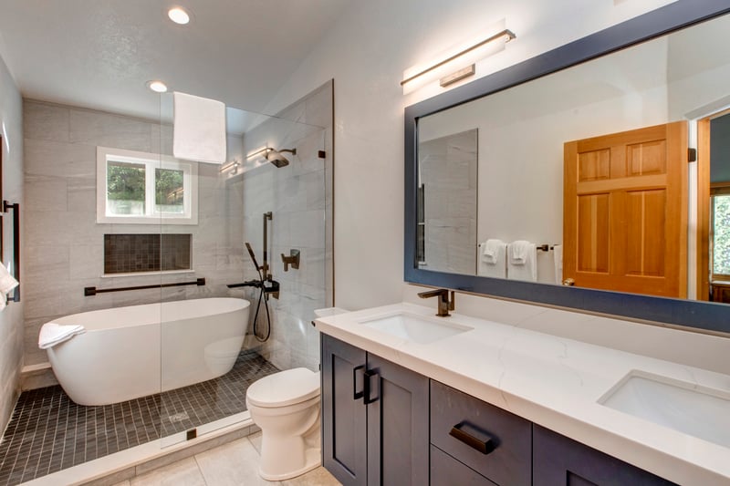 Your primary ensuite features a walk-in shower, soaking tub, and modern double vanity with granite counters.