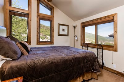 The 2nd bedroom includes a Queen bed, large windows, and calming natural light.