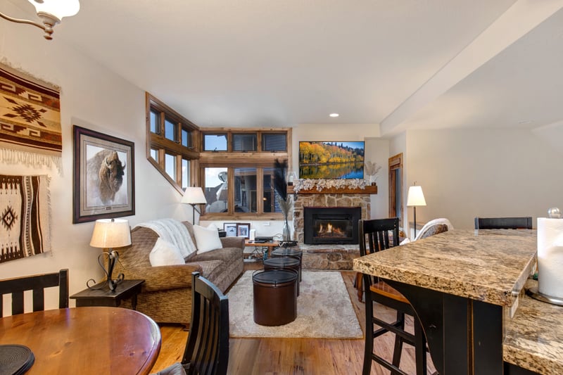 Lounge, dine, and entertain with ease in this open-concept great room with mountain-style decor.