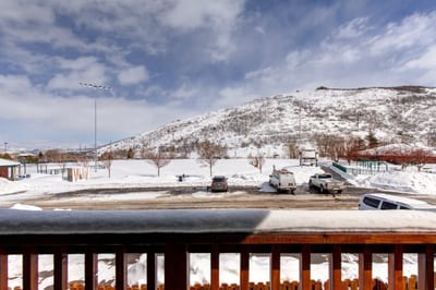 Snow-covered landscape with hill views and bright skies, just steps from the home. PPS-1416