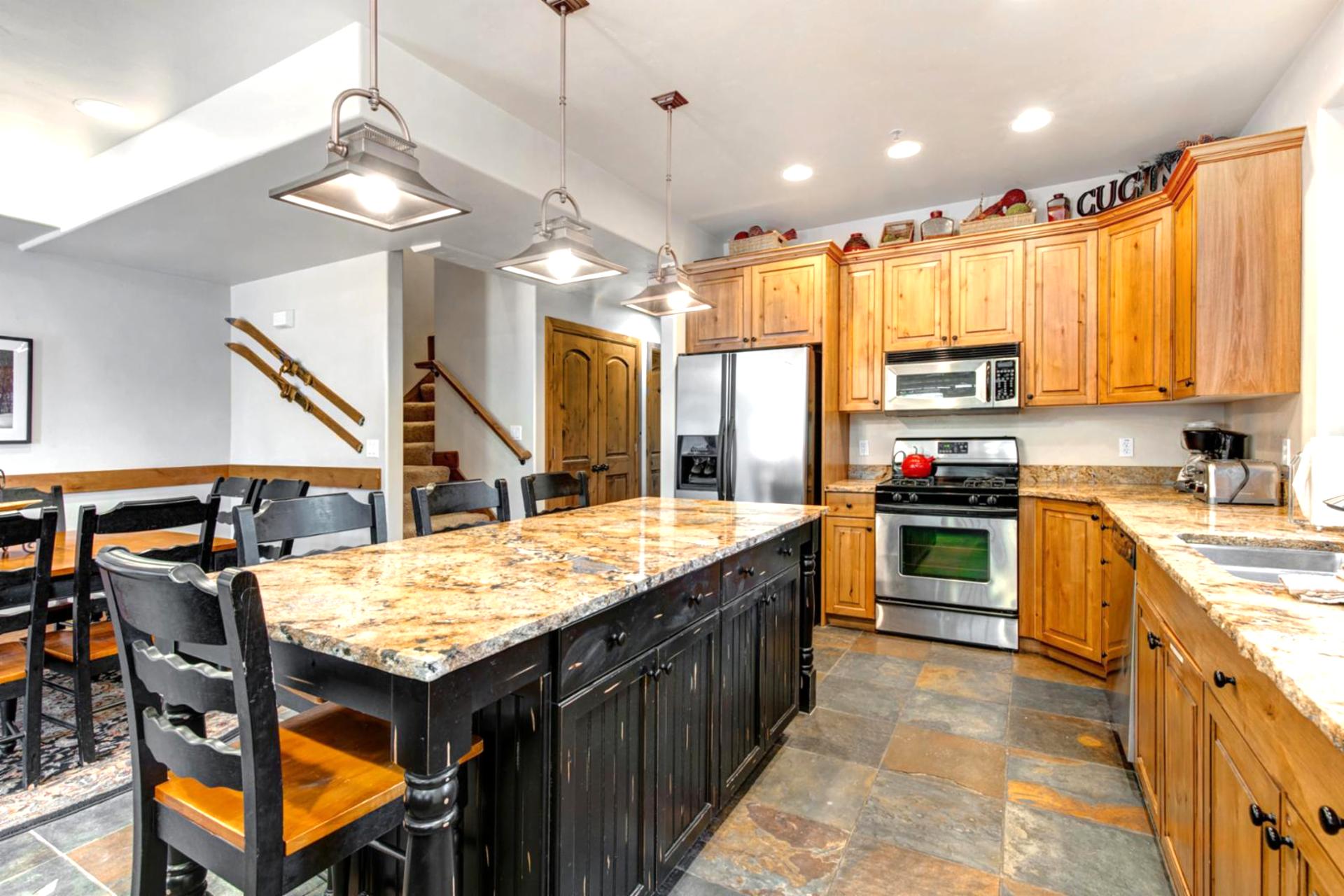 Cook with ease in your fully equipped kitchen with granite counters, stainless steel appliances, and seating for four at the island.
