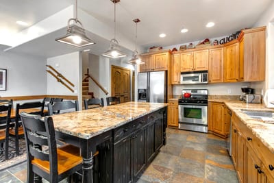 Cook with ease in your fully equipped kitchen with granite counters, stainless steel appliances, and seating for four at the island.