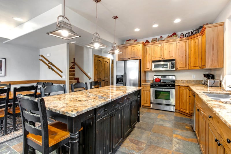 Cook with ease in your fully equipped kitchen with granite counters, stainless steel appliances, and seating for four at the island.