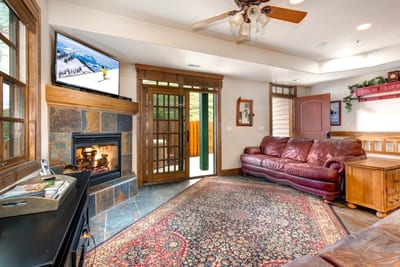 Lounge fireside with your group in the open-concept living space that connects seamlessly to dining and kitchen areas.