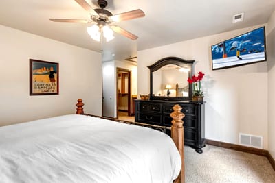 The primary bedroom includes a King bed, Smart TV, and access to a full ensuite bath.