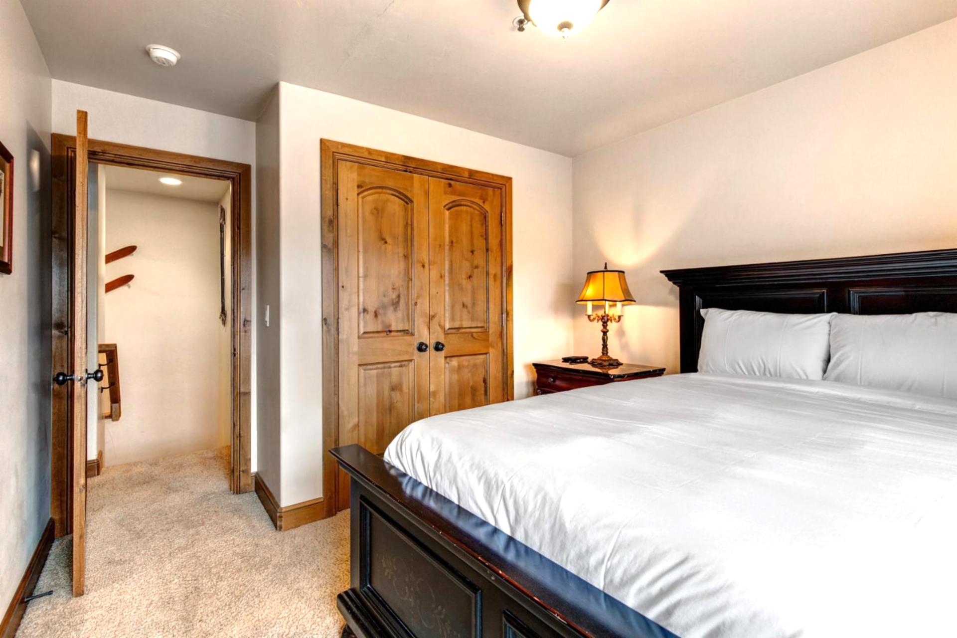 A second view of Guest Bedroom 1 shows its en suite bath access and spacious layout.
