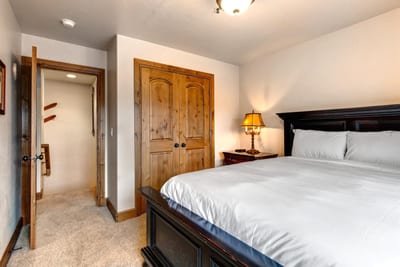 A second view of Guest Bedroom 1 shows its en suite bath access and spacious layout.