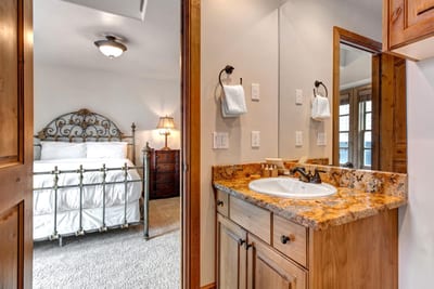 Guest Bathroom 1 includes granite counters, shower-tub combo, and quality finishes stocked with L’Occitane amenities.
