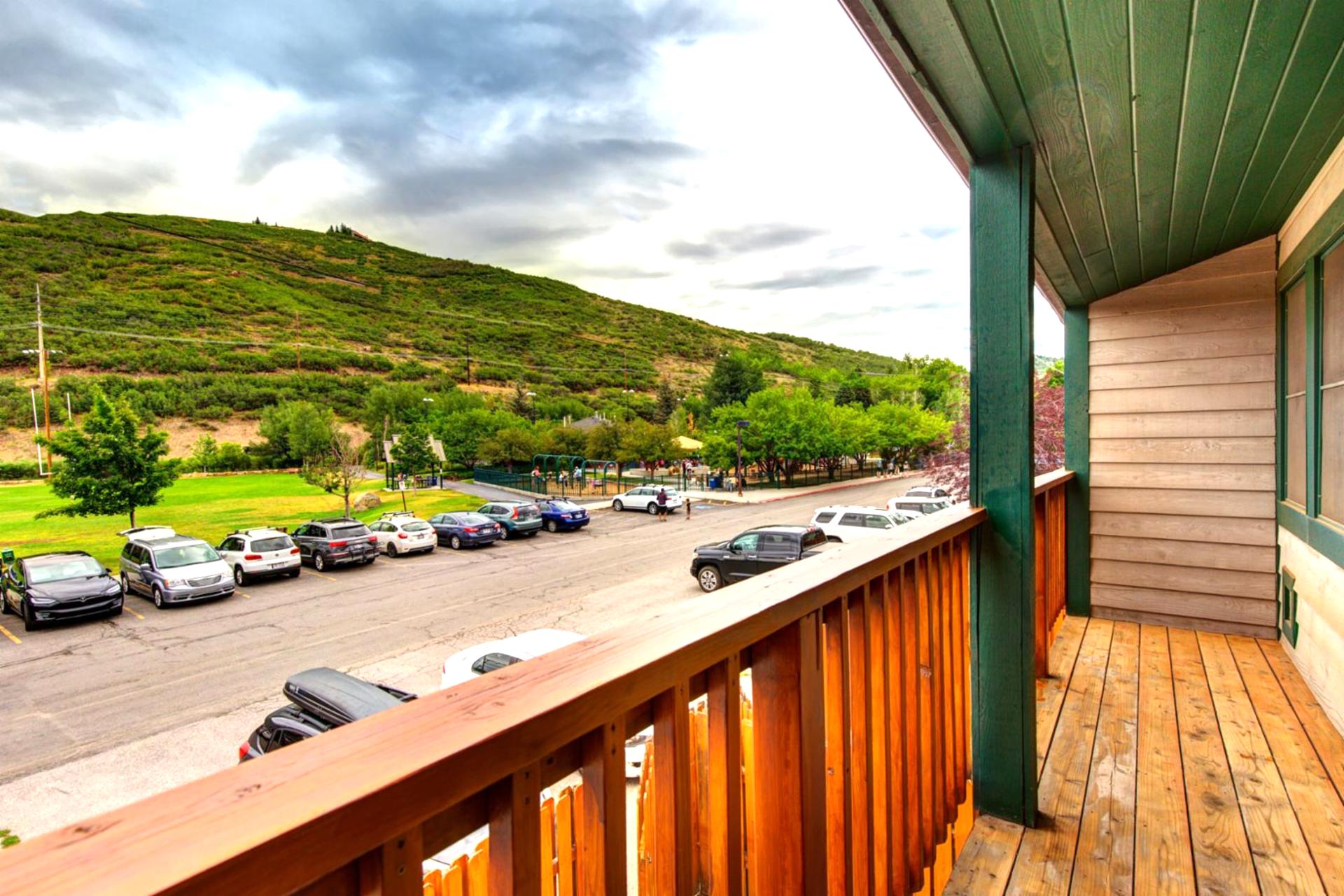 Step out from the bedrooms to this balcony with mountain greenery and neighborhood views.
