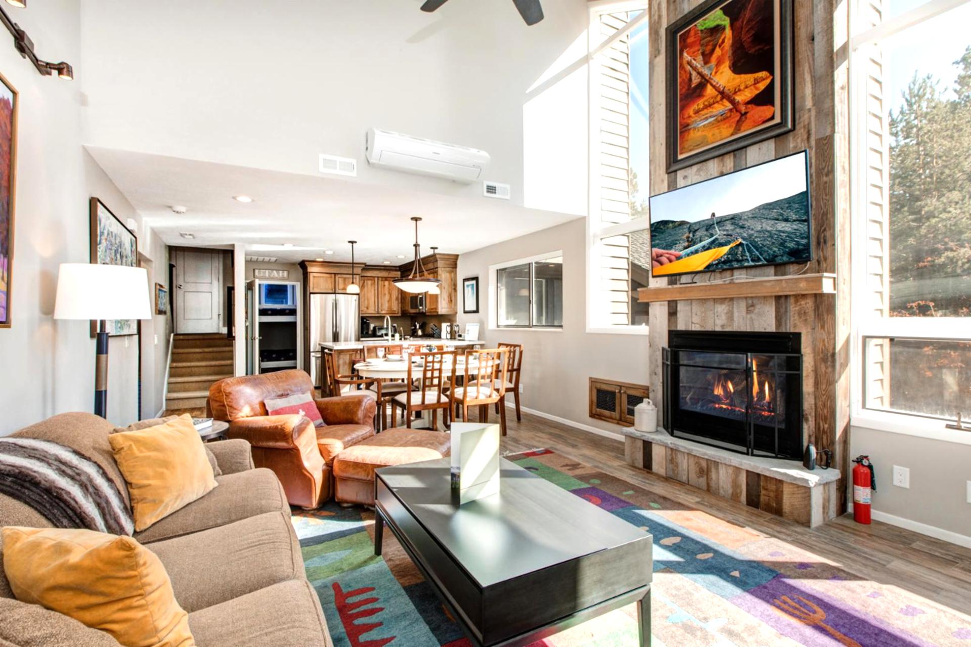 Relax by the fire with mountain views and colorful touches that make this space feel like home.