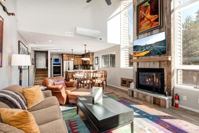 Relax by the fire with mountain views and colorful touches that make this space feel like home.