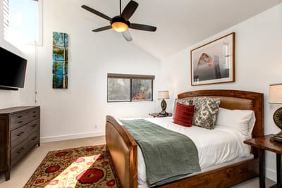 A closer look at the upstairs King suite, complete with Smart TV and plush bedding.
