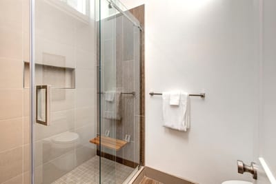 Walk-in tiled shower offers a refreshing rinse after a day on the mountain.