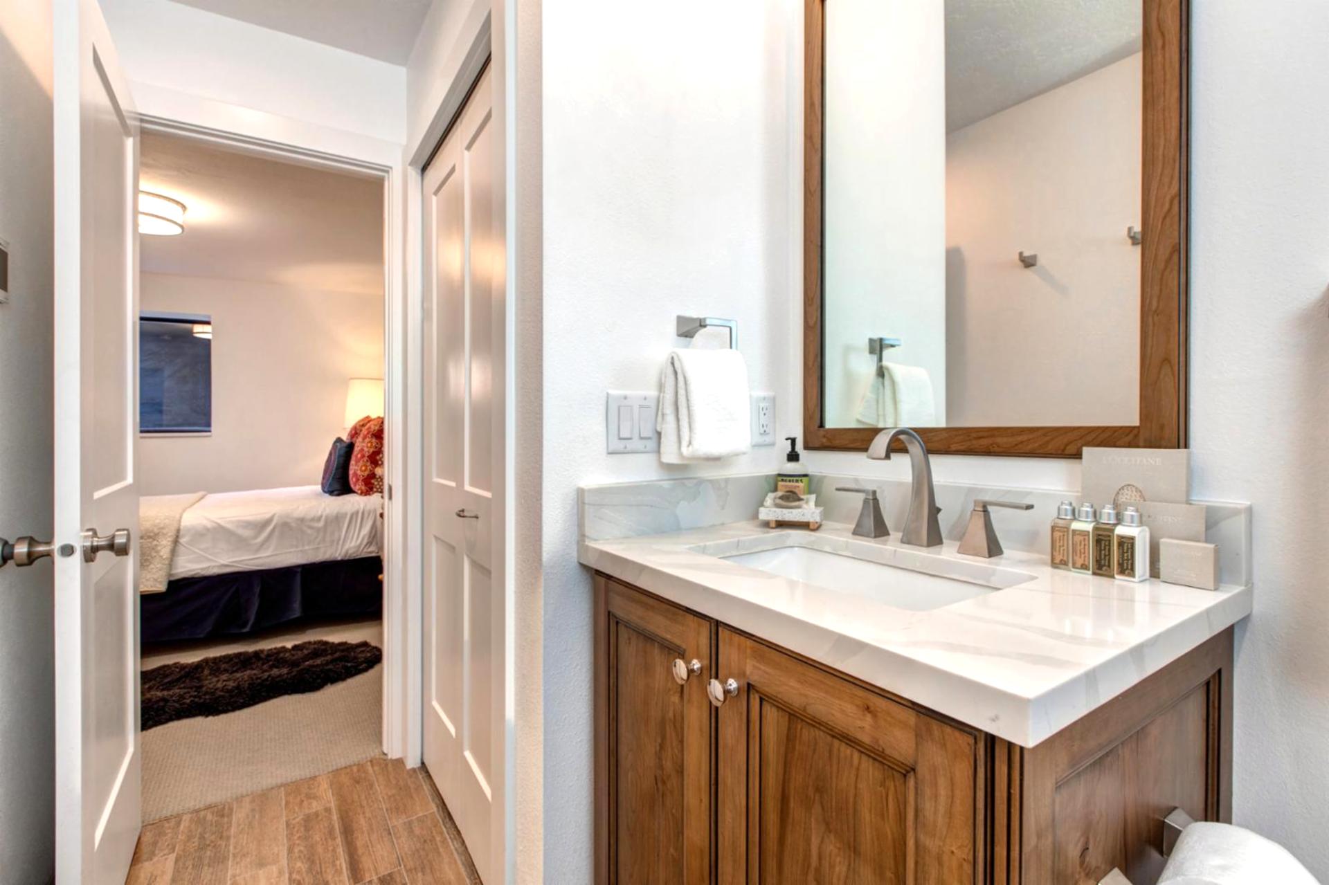 Stylish and functional, this full guest bath includes quality finishes and thoughtful amenities.
