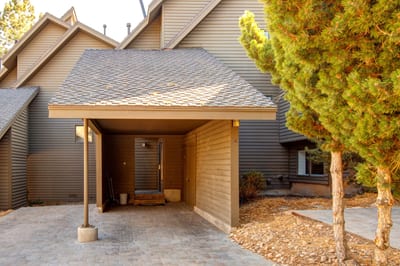 Covered carport parking keeps your vehicle snow-free and ready for mountain adventures.