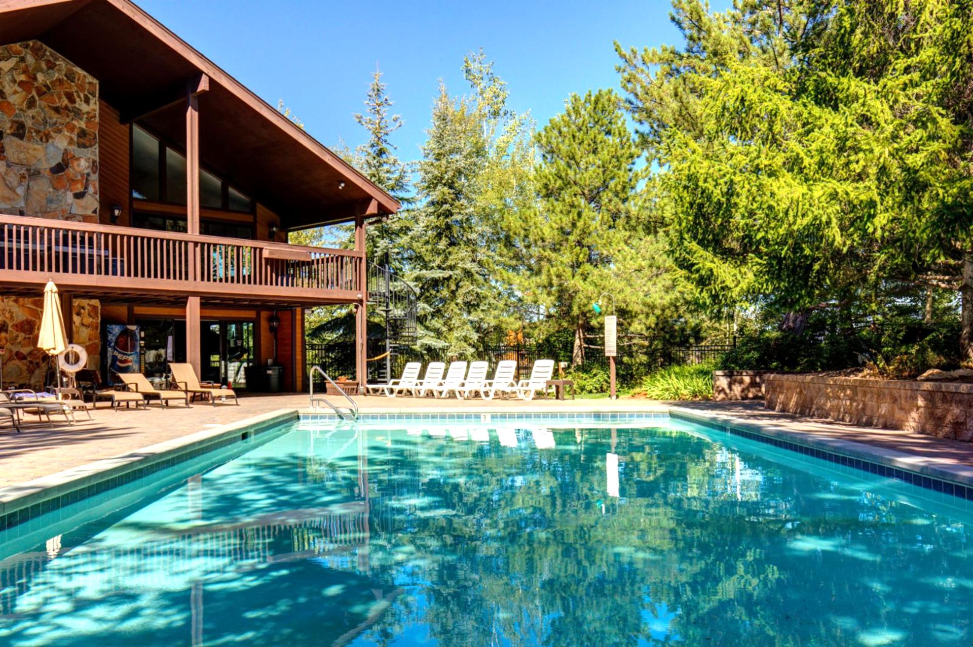 Cool off or relax in the seasonal pool, surrounded by pines and sunshine just steps from your unit.
