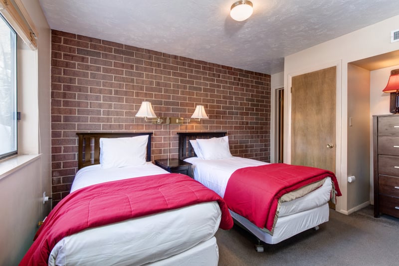 Guest Bedroom with two twin beds located on lower level