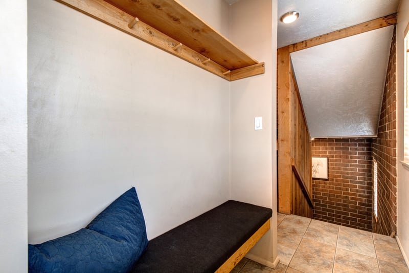 Drop your gear in the built-in bench area with hooks and storage
