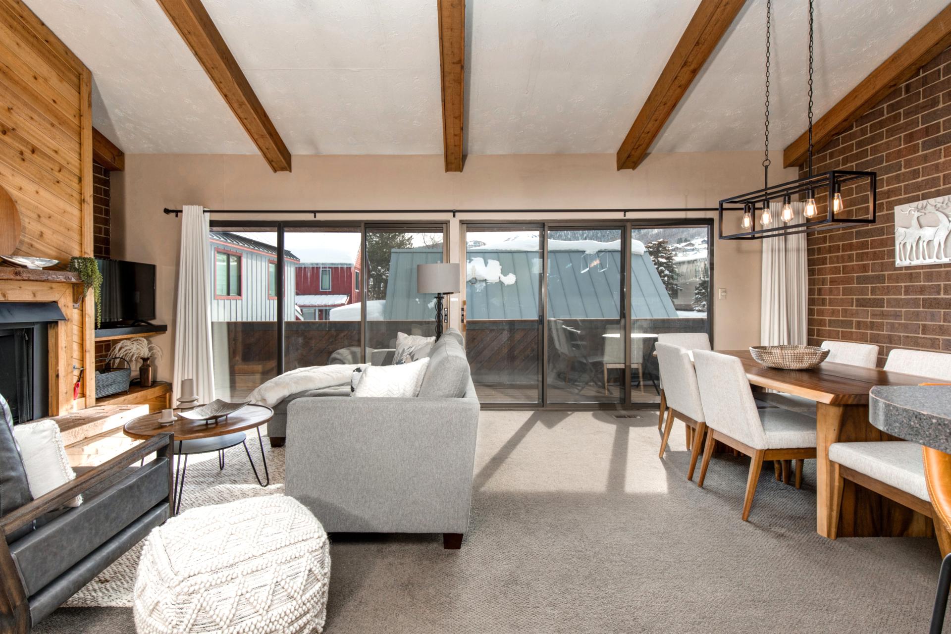 Another dining view highlights open layout, wood accents, and plenty of natural light.