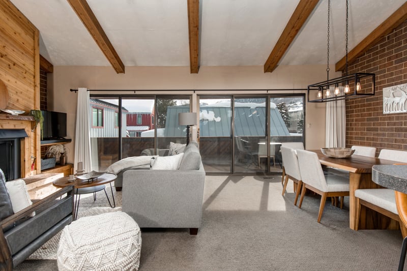 Another dining view highlights open layout, wood accents, and plenty of natural light.