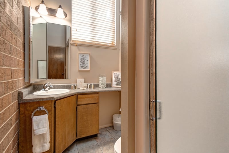 Attached to Bedroom 2, this bath includes a step-in shower and granite vanity.
