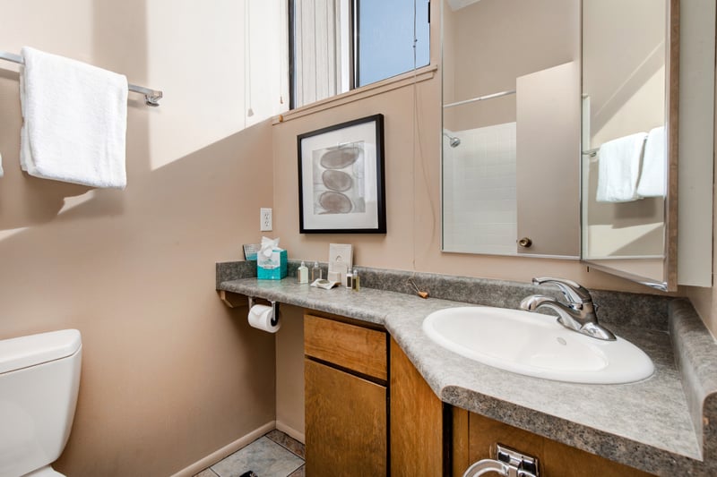Ensuite bath with granite counters and full tub/shower combo.