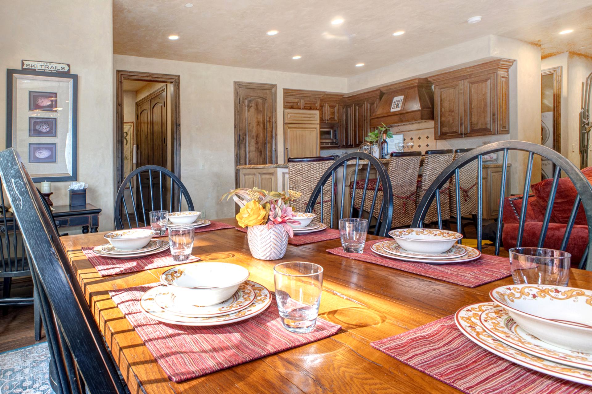 Soft lighting and lodge-inspired details make this dining space both elegant and homey.