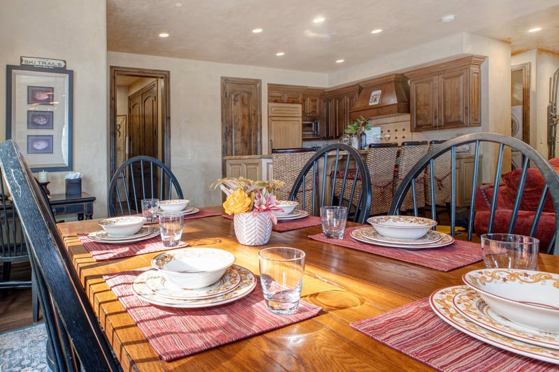 Soft lighting and lodge-inspired details make this dining space both elegant and homey.