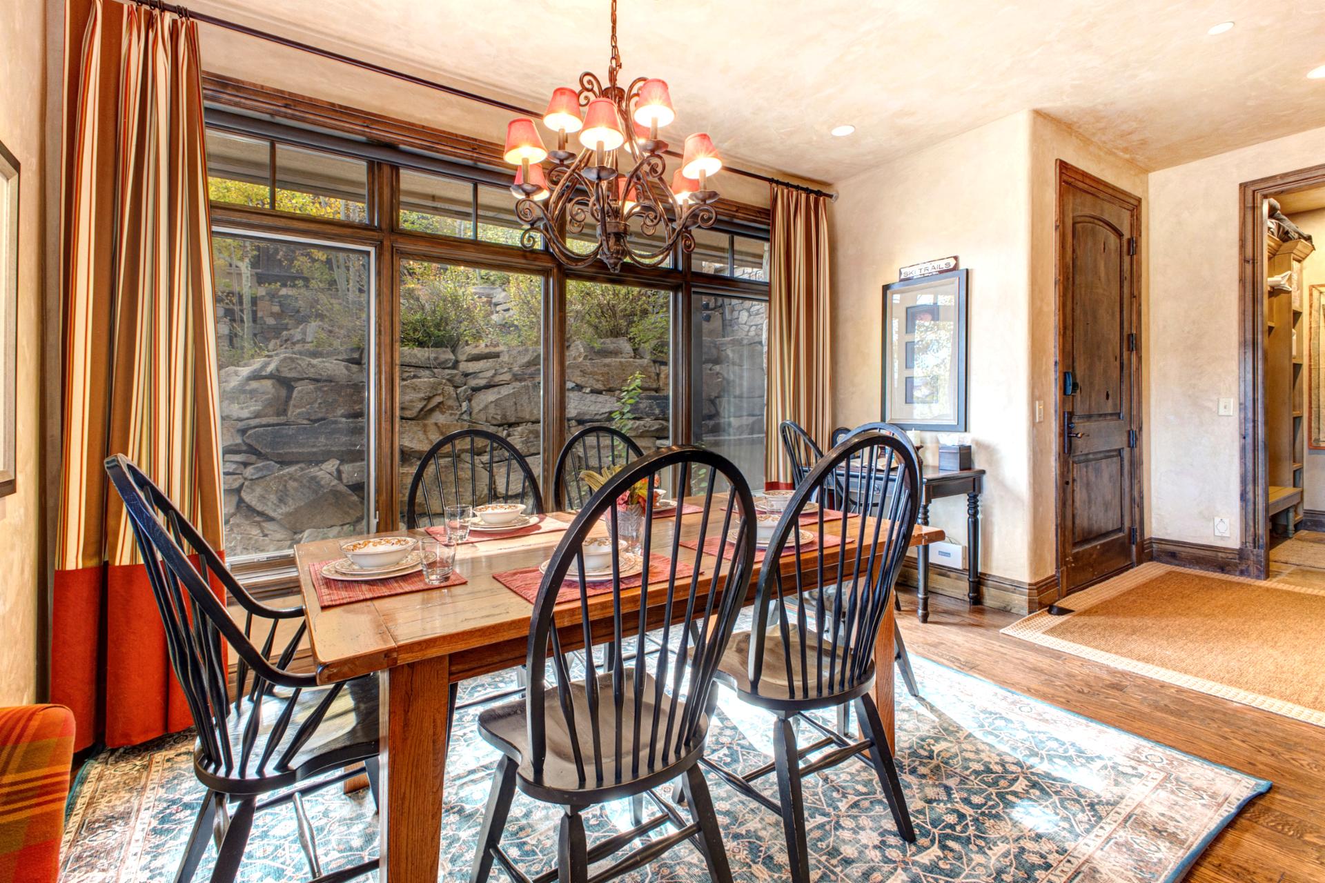 Large windows frame the natural surroundings as you dine or plan the next adventure.