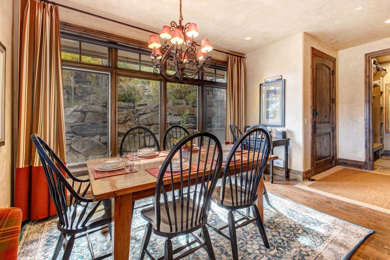 Large windows frame the natural surroundings as you dine or plan the next adventure.