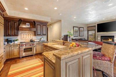 Your chef’s kitchen includes granite counters, premium appliances, and a central island for easy prep and serving.
VIN-14