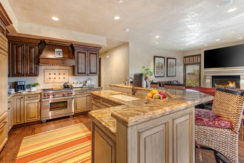 Your chef’s kitchen includes granite counters, premium appliances, and a central island for easy prep and serving.
VIN-14