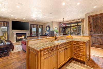 Wraparound counters and wood cabinetry give this kitchen both warmth and functionality. VIN-14