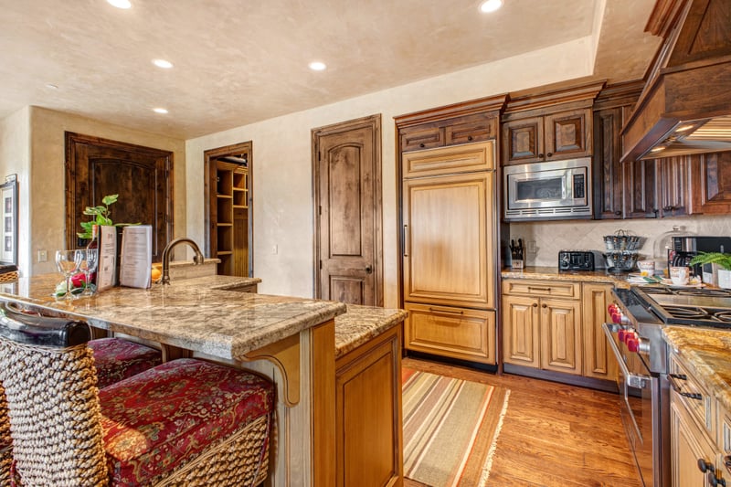 Enjoy cooking at home with a fully equipped kitchen, bar seating, and open layout.