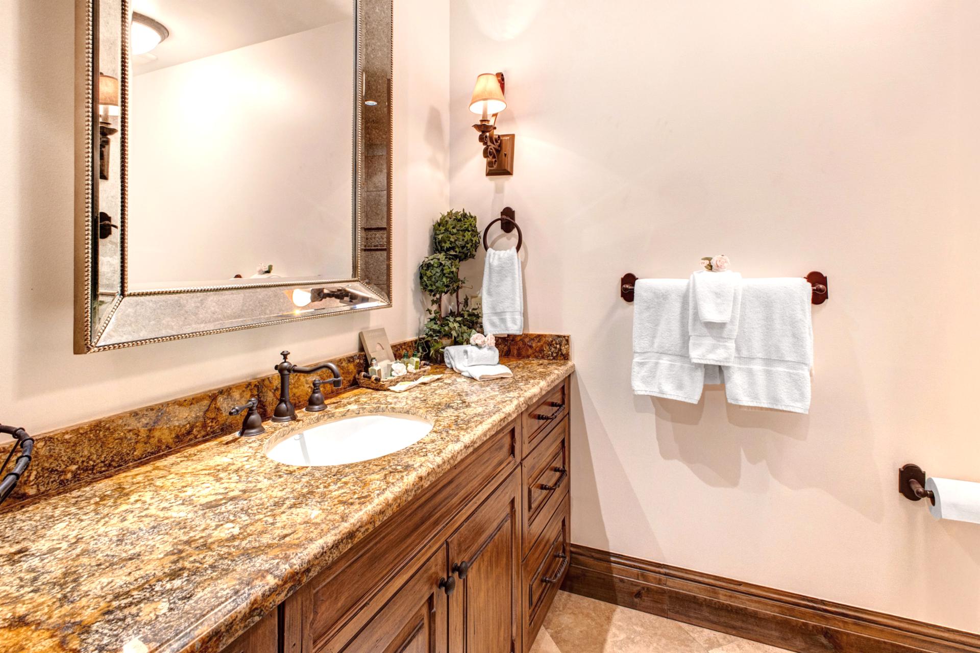 Full guest bathroom with updated finishes and step-in shower for easy access and comfort.