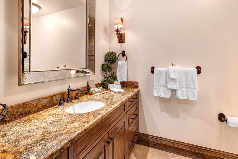 Full guest bathroom with updated finishes and step-in shower for easy access and comfort.