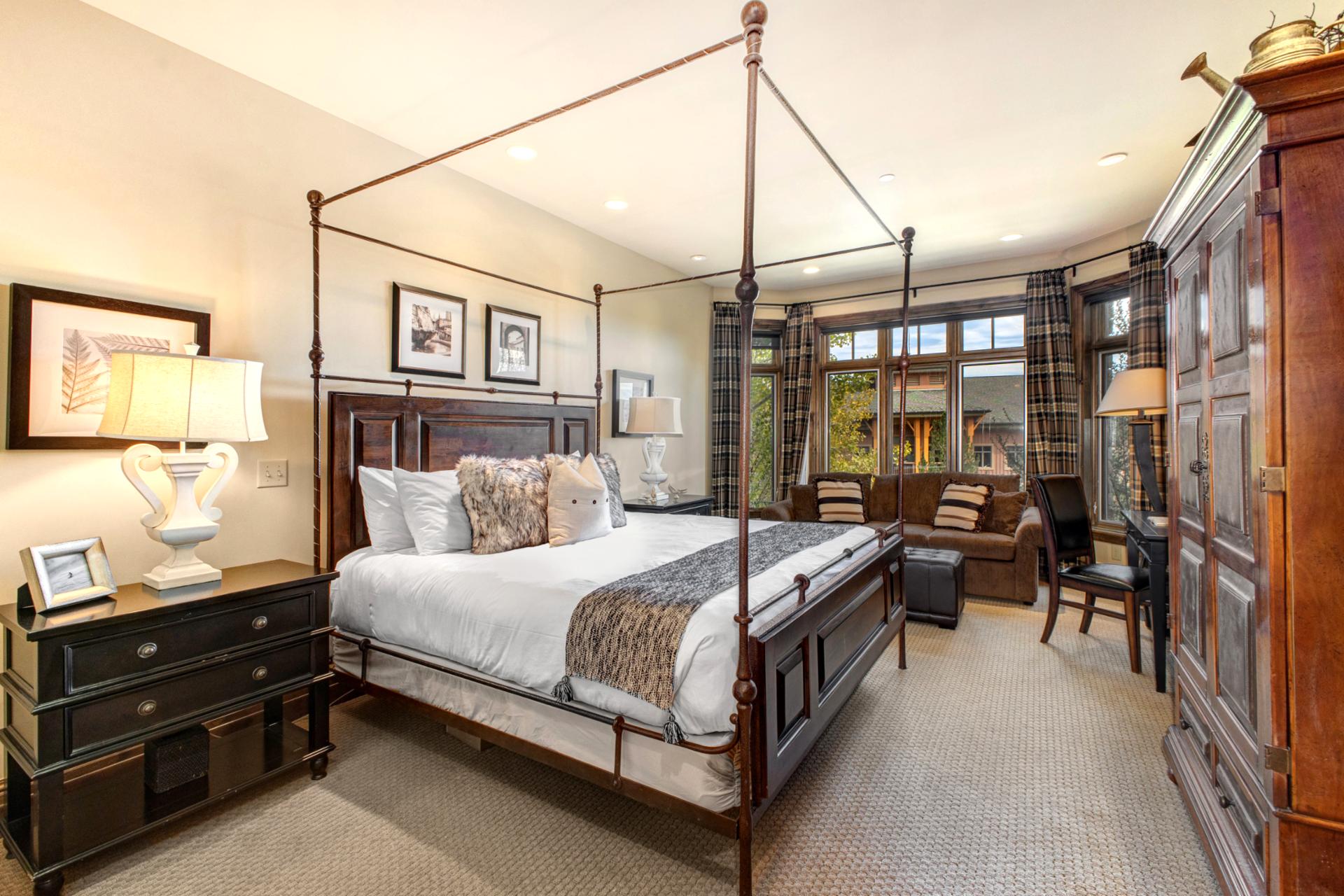 Sleep soundly in your King bed beneath vaulted ceilings with warm wood accents and mountain charm.