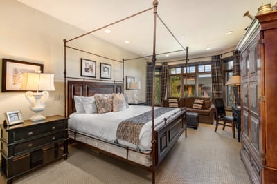 Sleep soundly in your King bed beneath vaulted ceilings with warm wood accents and mountain charm. VIN-14