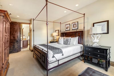 Your primary suite includes a King bed, plush lounge chair, and access to the luxurious en suite bath. VIN-14