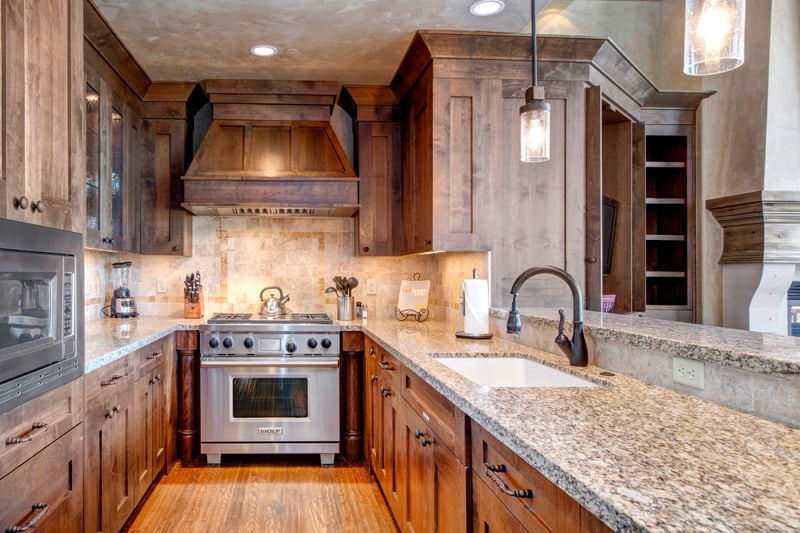 Your gourmet kitchen includes a gas range, granite counters, and high-end appliances for effortless meal prep.