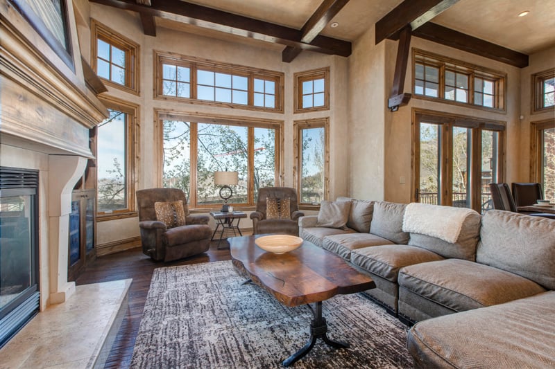 Floor-to-ceiling windows fill the living space with natural light and scenic views.